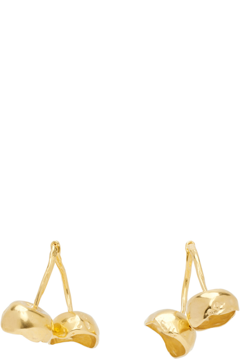Pair of handcrafted drop earrings in 18k yellow gold-plated brass.

· Graphic at drop
· Post-stud fastening 
· H1.5" x W1.5"

Part of the El Fruto collection.

Supplier color: Gold