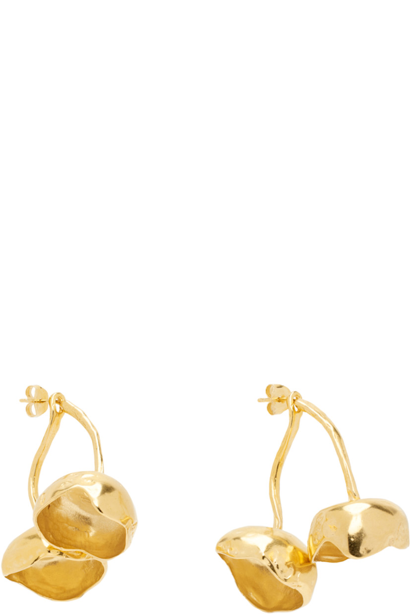 Pair of handcrafted drop earrings in 18k yellow gold-plated brass.

· Graphic at drop
· Post-stud fastening 
· H1.5" x W1.5"

Part of the El Fruto collection.

Supplier color: Gold