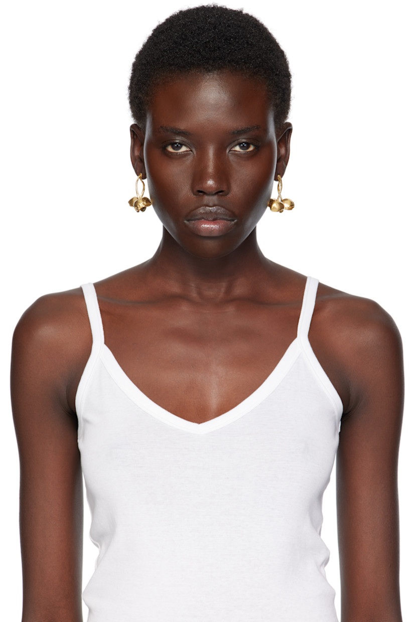 Pair of handcrafted drop earrings in 18k yellow gold-plated brass.

· Graphic at drop
· Post-stud fastening 
· H1.5" x W1.5"

Part of the El Fruto collection.

Supplier color: Gold