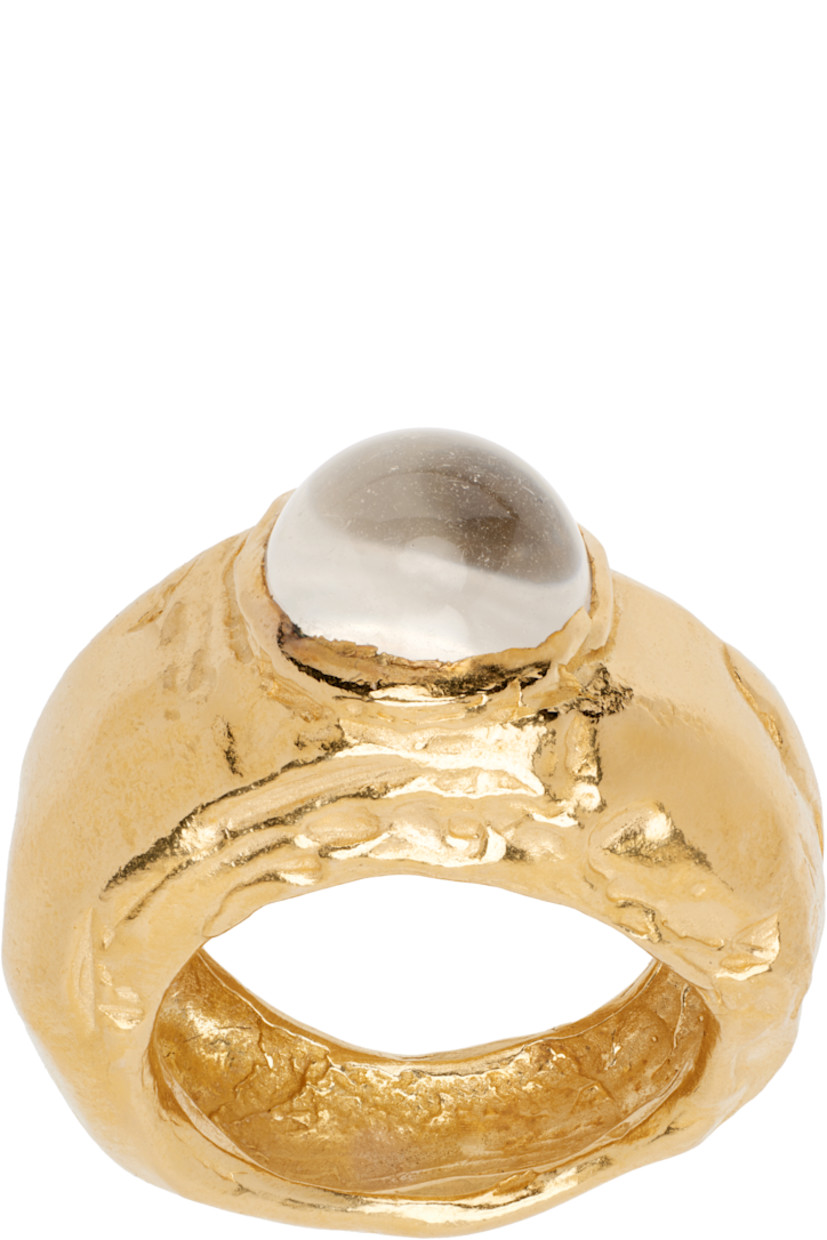 Handcrafted band ring in 18k yellow gold-plated recycled sterling silver. Bezel-set glass crystal at face.

Part of the El Fruto collection.

Supplier color: Gold plated/Clear