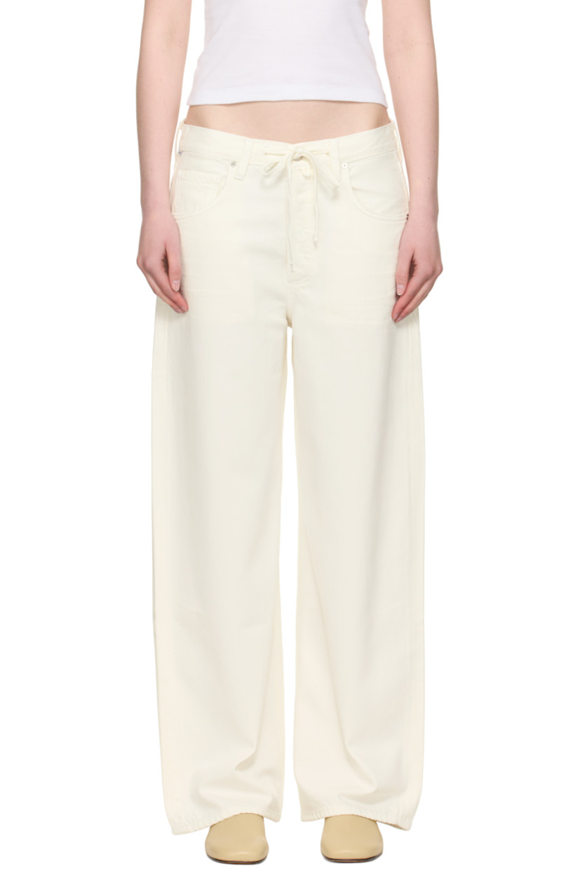 Non-stretch regenerative cotton denim jeans. Subtle distressing throughout. 

· Drawstring at waistband
· Belt loops
· Five-pocket styling
· Button fly 
· Logo patch at outseam 
· Leather logo patch at back waistband
· Logo-engraved silver-tone hardware

Supplier color: Pashmina