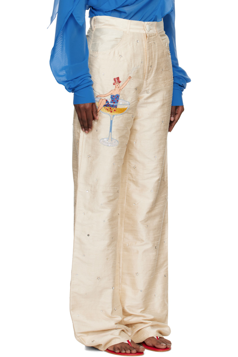 Handcrafted silk faille trousers.

· Sequins and beading throughout
· Belt loops
· Four-pocket styling
· Zip fly
· Logo graphic embroidered and beaded at front
· Crystal-cut logo at back pocket

Supplier color: White