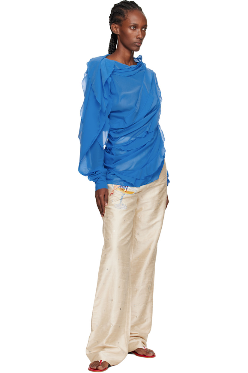 Handcrafted silk faille trousers.

· Sequins and beading throughout
· Belt loops
· Four-pocket styling
· Zip fly
· Logo graphic embroidered and beaded at front
· Crystal-cut logo at back pocket

Supplier color: White