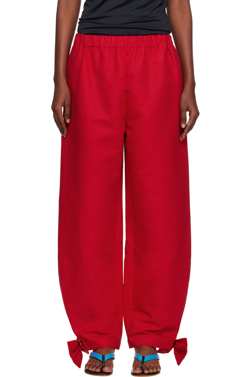 Linen canvas trousers.

· Elasticized waistband
· Two-pocket styling
· Curved outseams
· Detachable bow and press-stud fastening at cuffs

Supplier color: Red