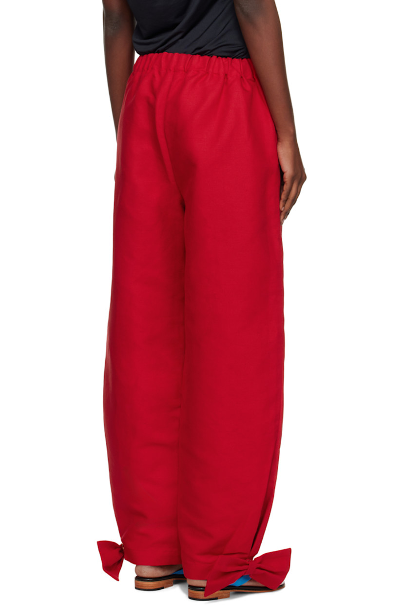 Linen canvas trousers.

· Elasticized waistband
· Two-pocket styling
· Curved outseams
· Detachable bow and press-stud fastening at cuffs

Supplier color: Red