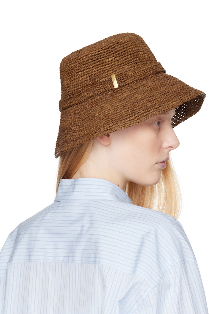 Woven raffia bucket hat in brown. 

· Strap with logo plaque
· Unlined

Supplier color: Brown