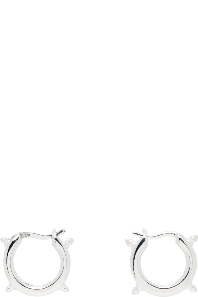 Pair of hoop earrings in sterling silver.

· Spikes and fixed curb chain detailing at hoop
· Hinged-post fastening
· D0.5"

Supplier color: Sterling silver