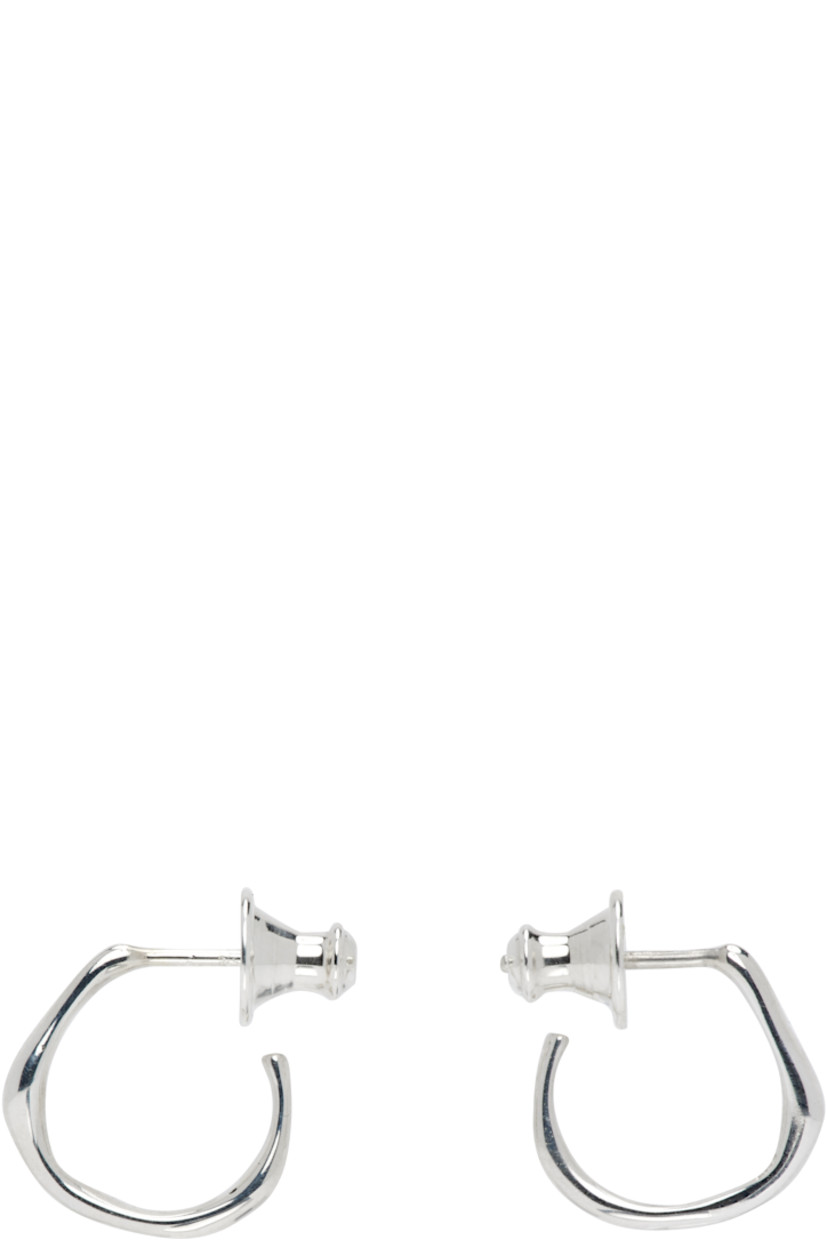 Pair of handcrafted open hoop earrings in sterling silver. 

· Post-stud fastening 
· D0.5"

Supplier color: Sterling silver