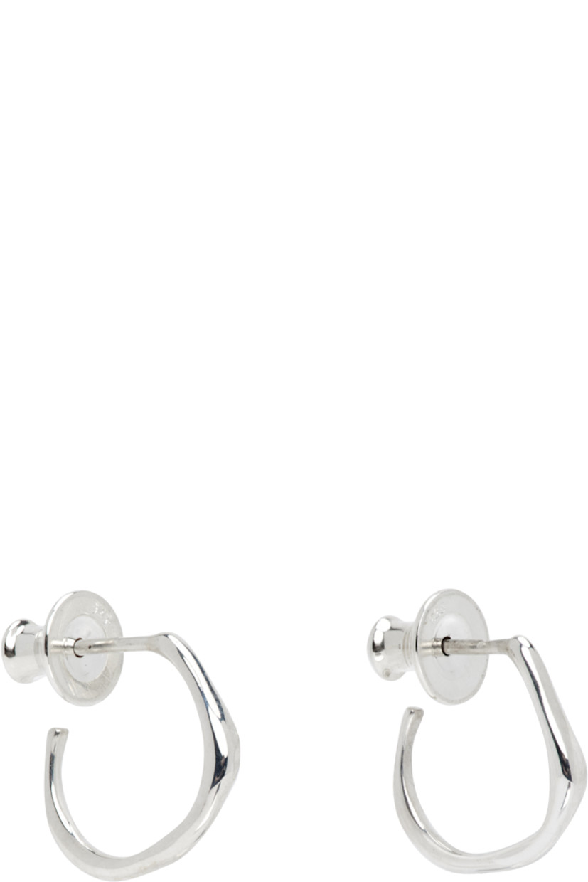 Pair of handcrafted open hoop earrings in sterling silver. 

· Post-stud fastening 
· D0.5"

Supplier color: Sterling silver