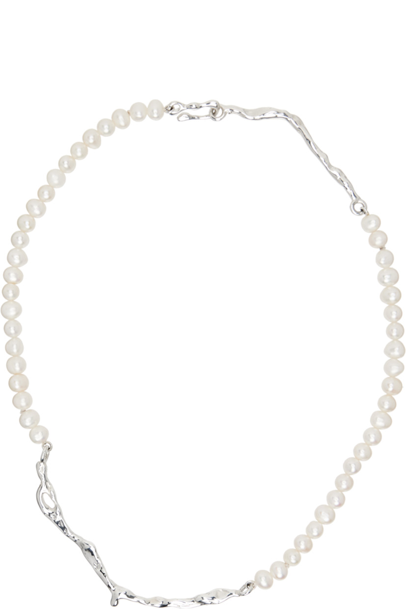 Handcrafted beaded pearl necklace.

· Hand-carved hook-eye fastening 
· Sterling silver hardware 
· L17.5"

Supplier color: Sterling silver
