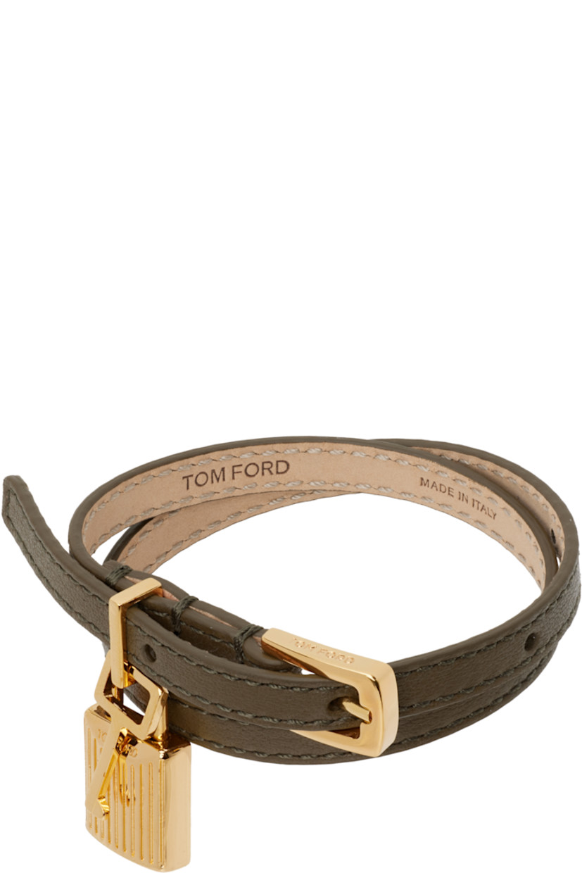 Wraparound grained calfskin bracelet in khaki.

· Fluted padlock charm at face
· Logo-engraved pin-buckle fastening 
· Gold-tone hardware
· L15.5"

Supplier color: Dark olive