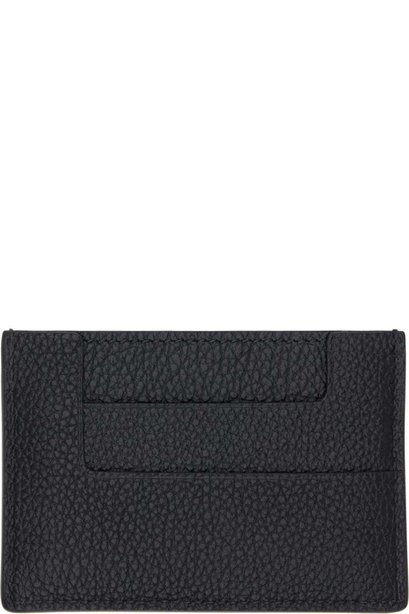 Pebble-grained calfskin card holder. 

· Inset logo hardware at face
· Four card slots and central note slot 
· Sheepskin lining 
· Gold-tone hardware
· H2.75" x W4" 

Supplier color: Black