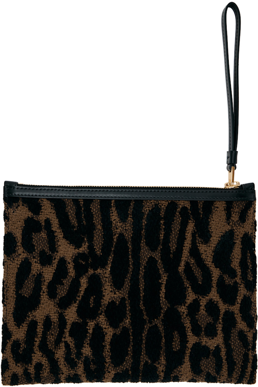 Cotton hopsack and buffed calfskin pouch. 

· Jacquard leopard pattern throughout 
· Logo embroidered at face 
· Wristlet at zip closure
· Canvas lining 
· Gold-tone hardware
· H7.25" x W9.5" 

Supplier color: Brown/Black