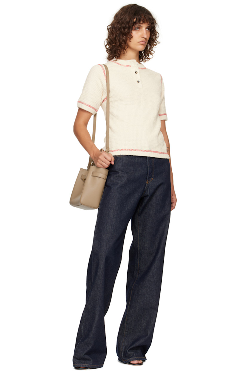 Grained calfskin top handle bag.

· Twin carry handles
· Adjustable and detachable crossbody strap
· Logo hardware at adjustable post-stud strap
· Logo stamp at face
· Magnetic tab fastening at throat
· Patch pocket at interior
· Leather interior
· H8" x W9" x D4" 

Supplier color: Light beige