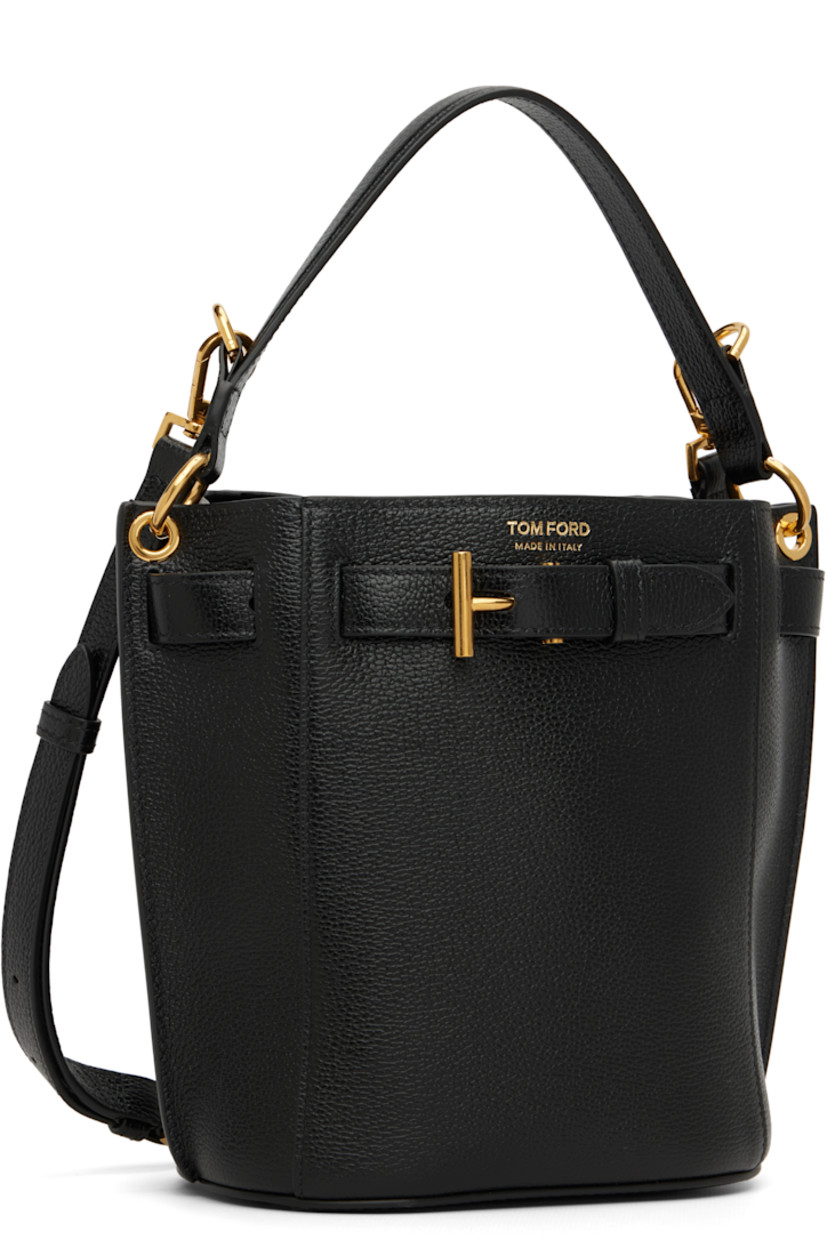 Grained calfskin shoulder bag.

· Fixed carry handle
· Adjustable and detachable shoulder strap
· Logo stamp at face
· Logo hardware at pin-buckle strap
· Open throat
· Patch pocket at interior
· Faux-suede lining
· Logo-engraved gold-tone hardware
· H8" x W6.75" x D4.75"

Supplier color: Black
