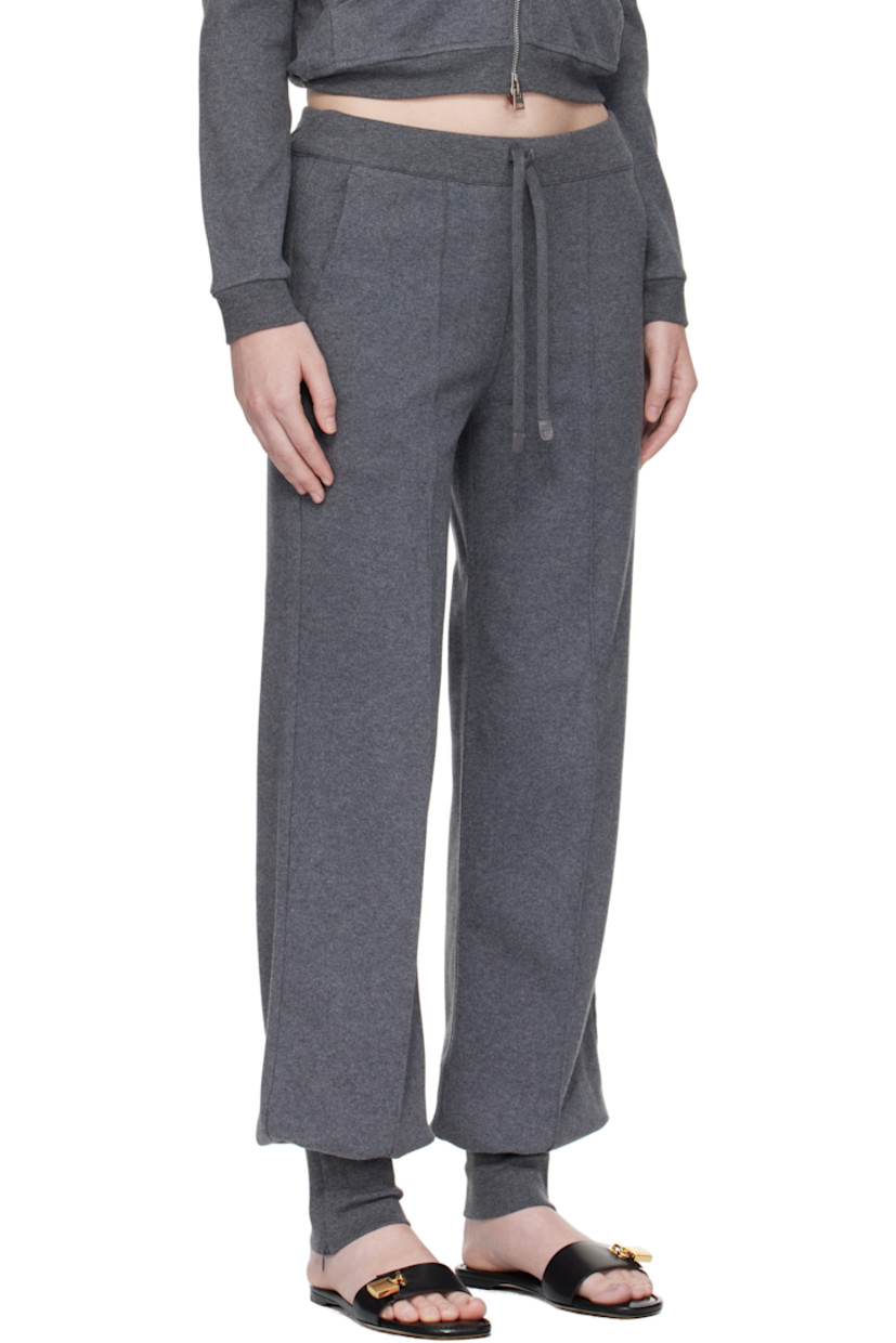 Peached cotton jersey lounge pants.

· Drawstring at elasticized waistband
· Three-pocket styling
· Mock fly
· Pinched seam at front and back legs
· Zip vent at rib-knit cuffs
· Leather logo flag at back pocket

Supplier color: Dark grey melange
