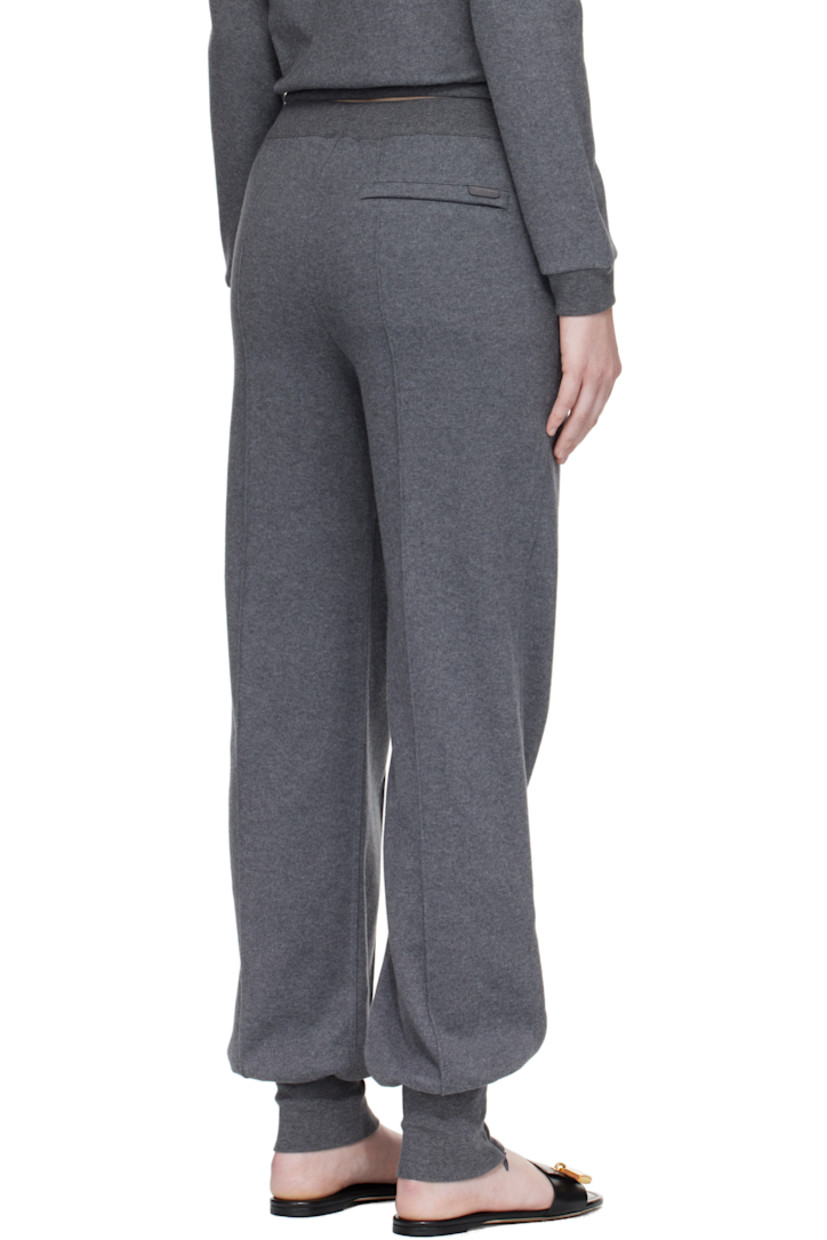 Peached cotton jersey lounge pants.

· Drawstring at elasticized waistband
· Three-pocket styling
· Mock fly
· Pinched seam at front and back legs
· Zip vent at rib-knit cuffs
· Leather logo flag at back pocket

Supplier color: Dark grey melange