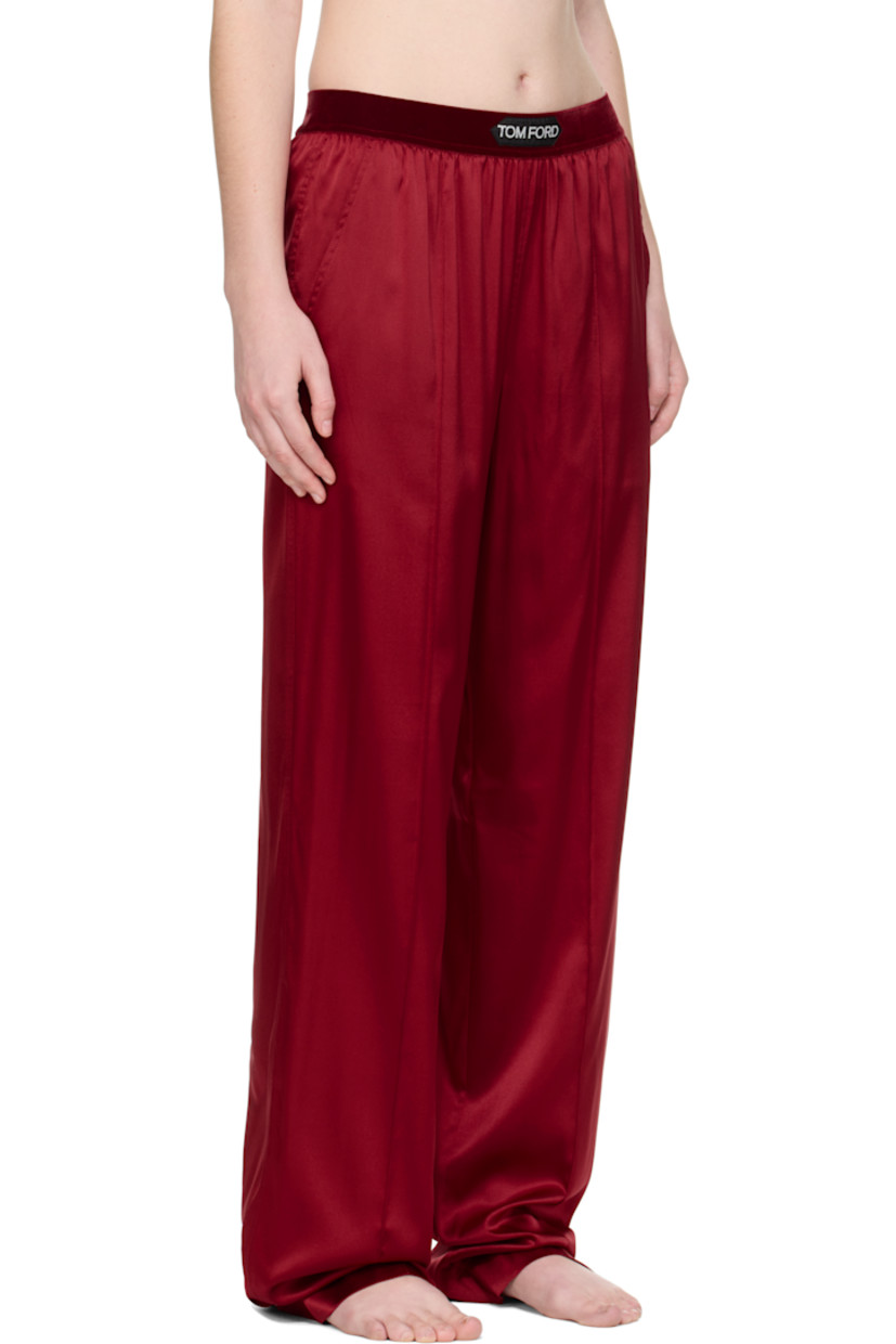 Stretch silk satin lounge pants.

· Loose-fit
· Logo patch at velour elasticized waistband
· Four-pocket styling
· Pinched seams at legs

Supplier color: Crimson