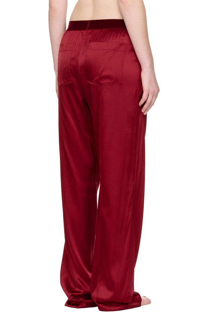 Stretch silk satin lounge pants.

· Loose-fit
· Logo patch at velour elasticized waistband
· Four-pocket styling
· Pinched seams at legs

Supplier color: Crimson