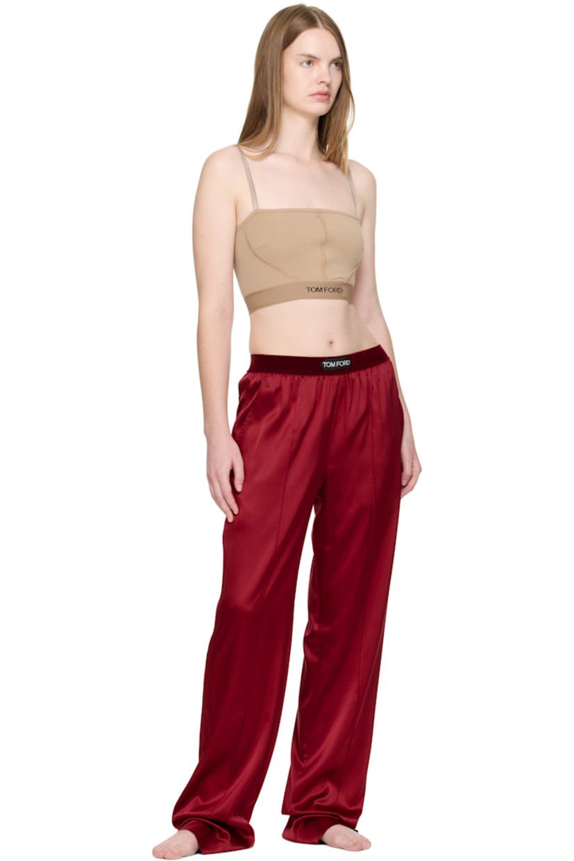 Stretch silk satin lounge pants.

· Loose-fit
· Logo patch at velour elasticized waistband
· Four-pocket styling
· Pinched seams at legs

Supplier color: Crimson