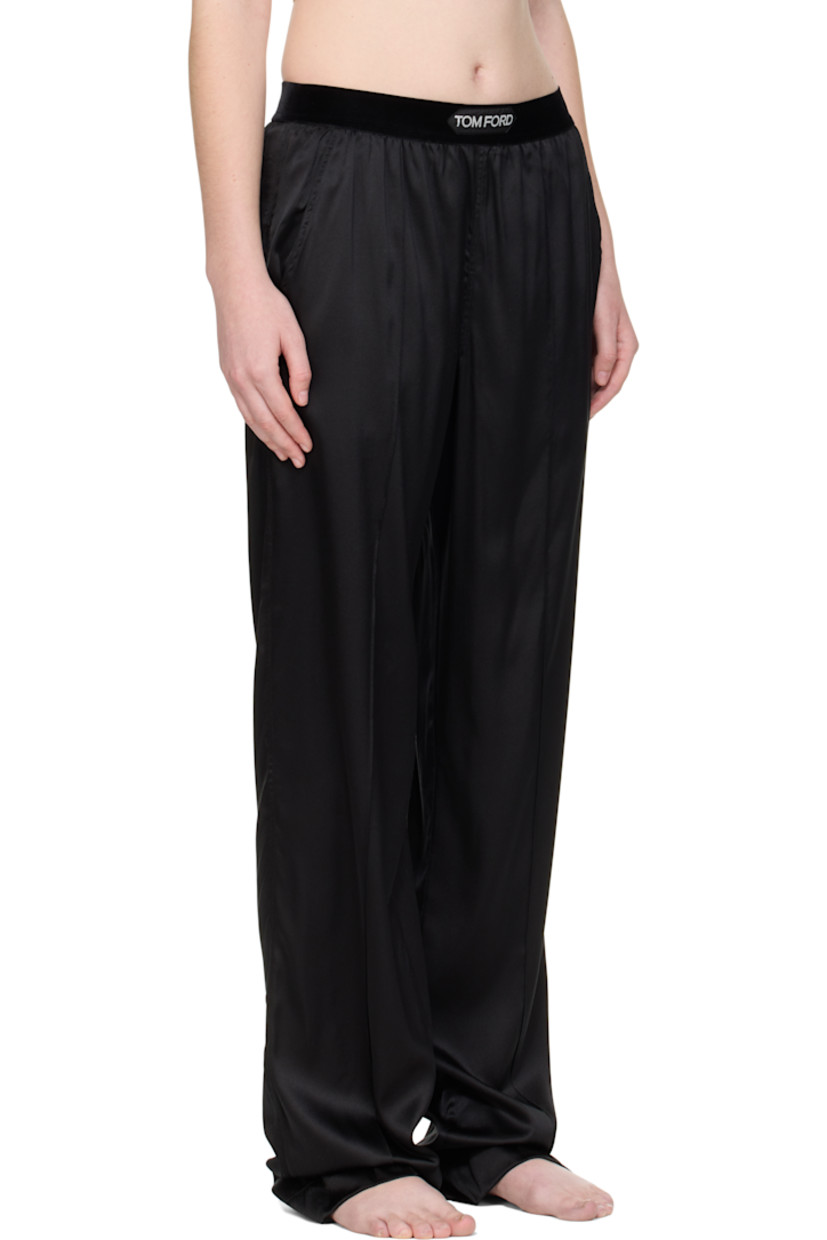 Stretch silk satin lounge pants.

· Loose-fit
· Logo patch at velour elasticized waistband
· Four-pocket styling
· Pinched seams at legs

Supplier color: Black