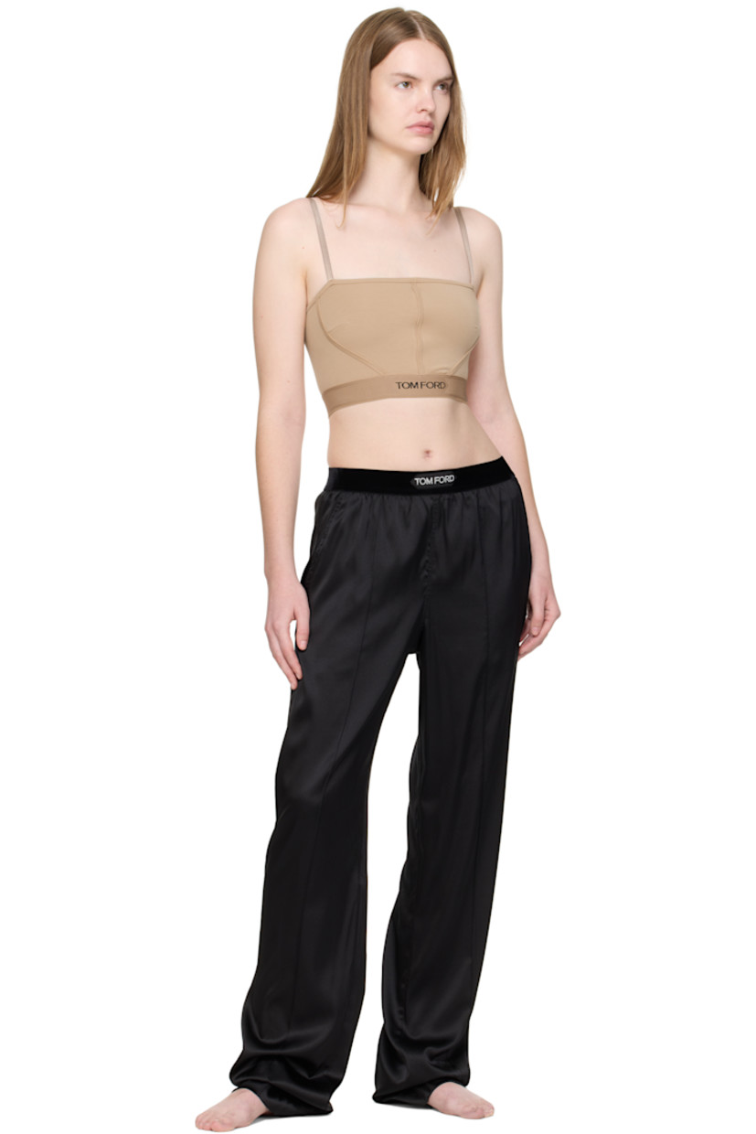 Stretch silk satin lounge pants.

· Loose-fit
· Logo patch at velour elasticized waistband
· Four-pocket styling
· Pinched seams at legs

Supplier color: Black