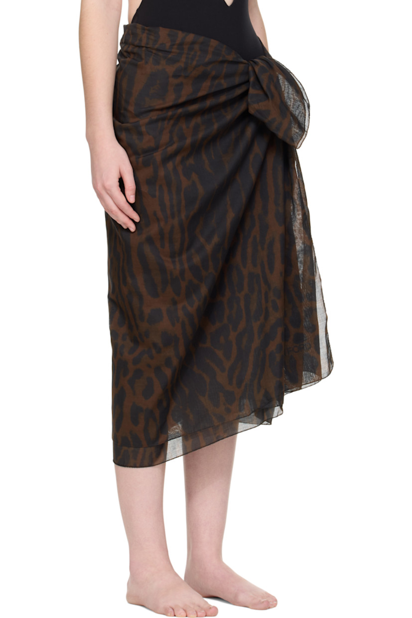 Cotton muslin cover-up skirt.

· Leopard pattern printed throughout
· Wrap construction
· Self-tie closure

Supplier color: Brown/Black
