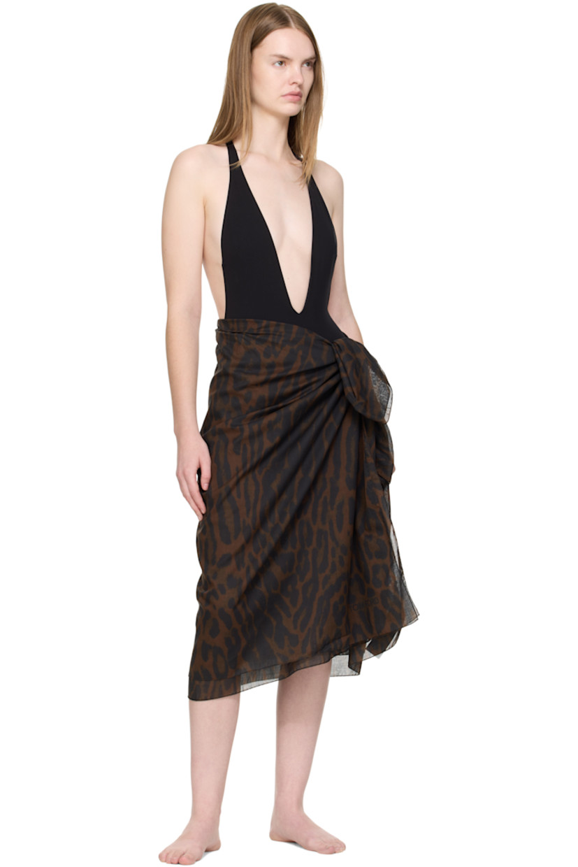 Cotton muslin cover-up skirt.

· Leopard pattern printed throughout
· Wrap construction
· Self-tie closure

Supplier color: Brown/Black