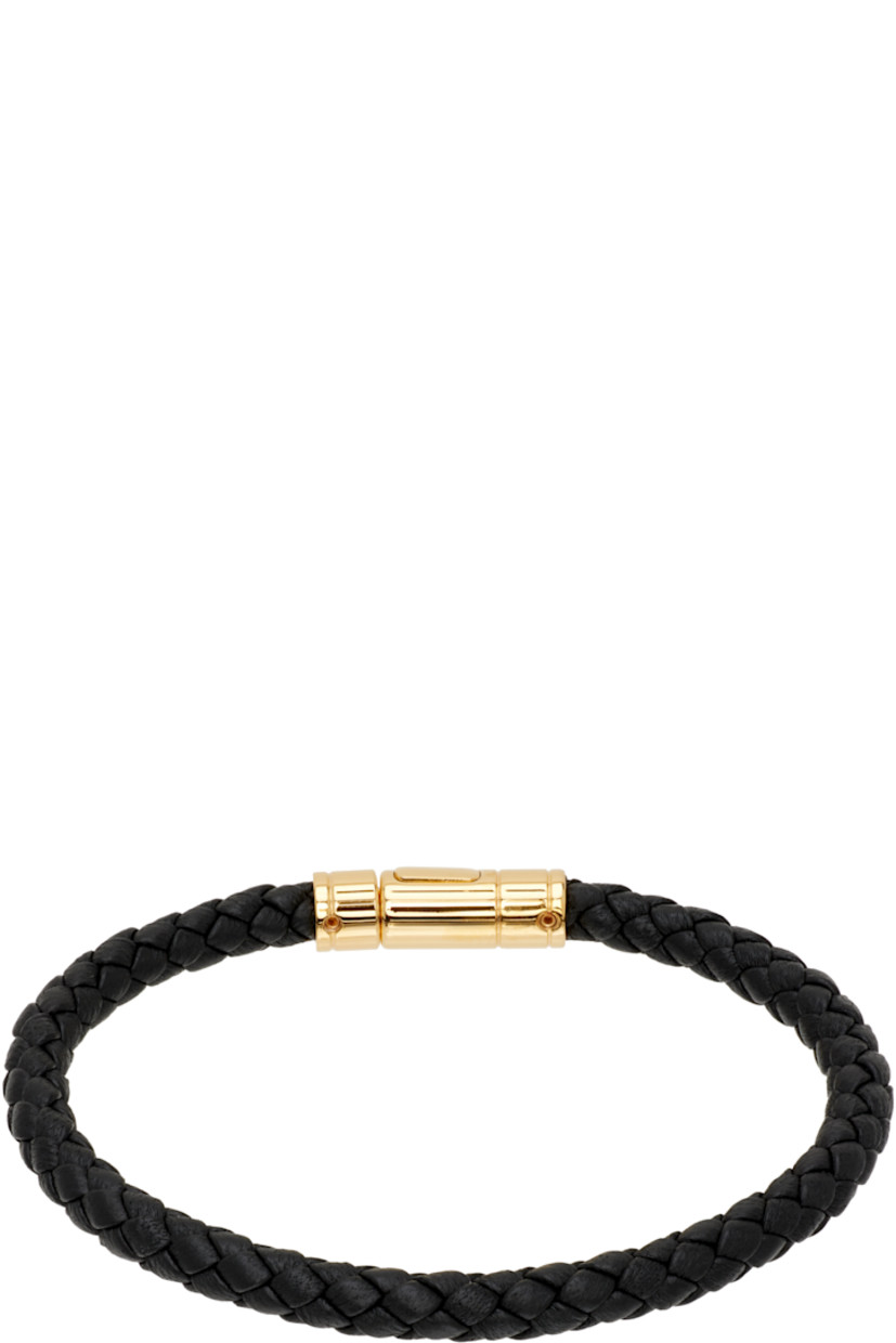 Braided grained calfskin bracelet.

· Logo-engraved press-stud closure
· Gold-tone brass hardware

Supplier color: Black