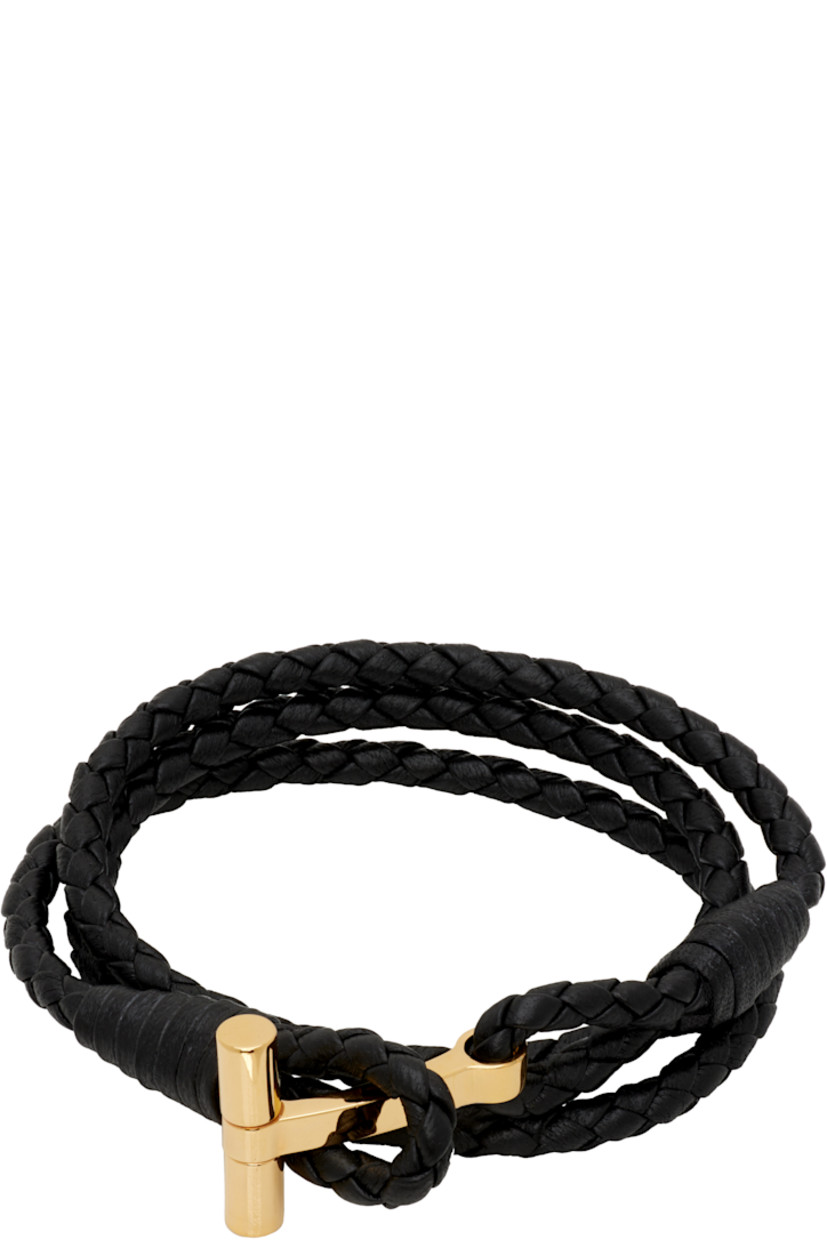 Wraparound braided grained calfskin bracelet in black. 

· Logo hardware at toggle closure
· Gold-tone brass hardware

Supplier color: Black