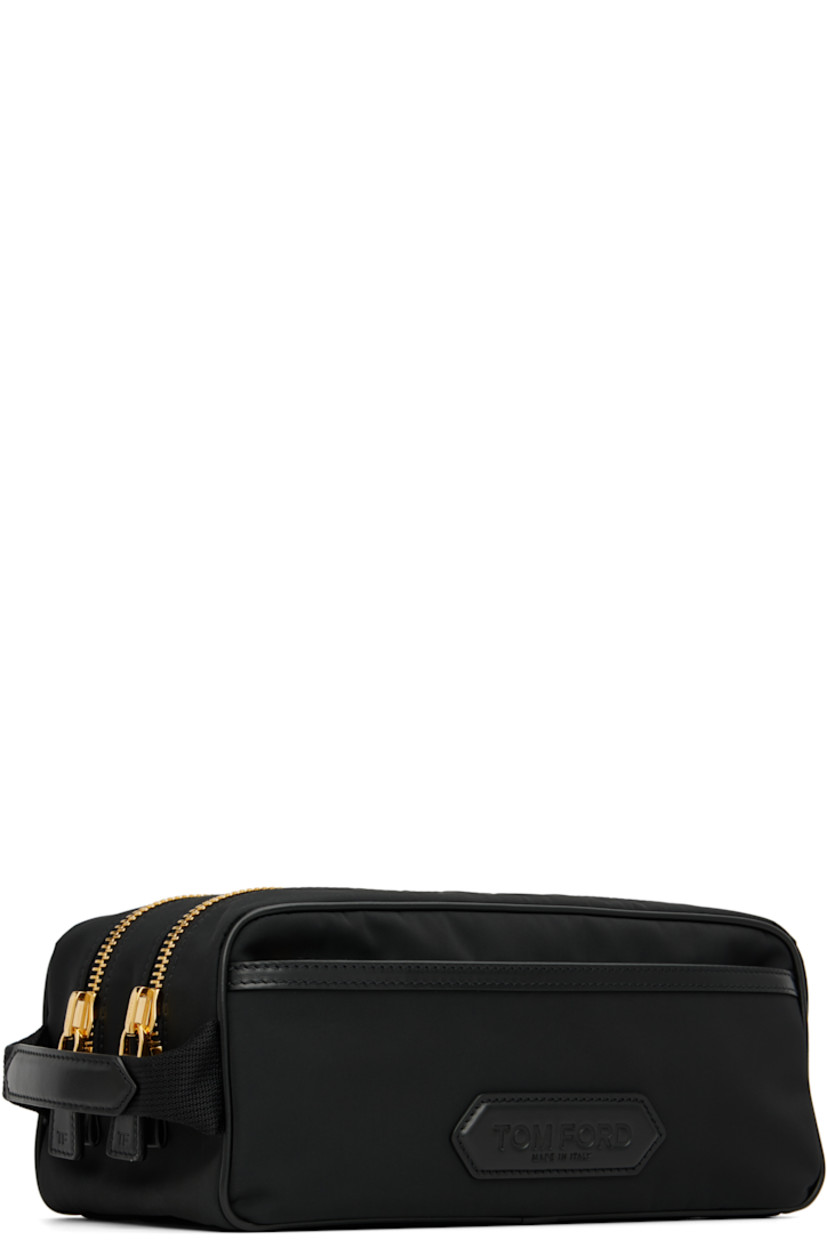 Technical canvas toiletry bag.

· Zip pocket with logo patch at face
· Carry handle at side
· Twin zip compartments
· Zip pocket at interior
· H5" x W10" x D5"

Supplier color: Black