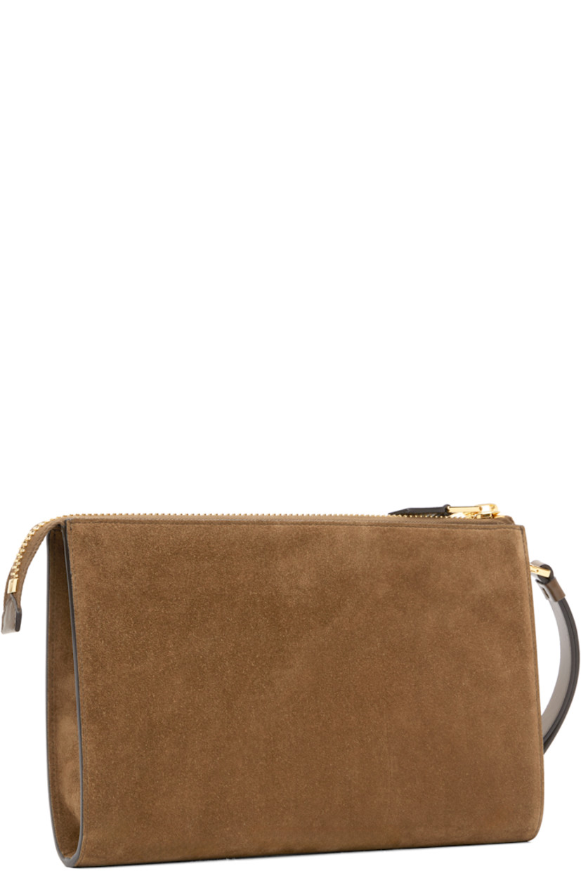 Calfskin suede pouch.

· Logo-embossed wristlet at top
· Gold-tone logo stamp at face
· Zip closure
· Patch pocket at interior 
· Cotton-blend twill lining
· Gold-tone hardware
· H7" x W10.25" x D1"

Supplier color: Walnut