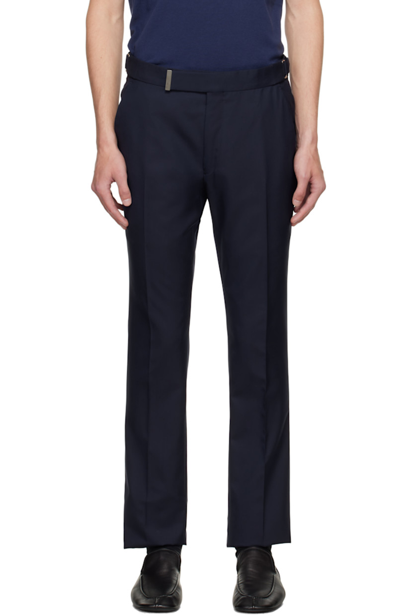 Plain-woven wool trousers.

· Cinch tabs at waistband
· Four-pocket styling
· Zip fly
· Creased legs
· Unfinished hem
· Buttons and notch at back waistband
· Partial satin lining

Supplier color: Midnight blue