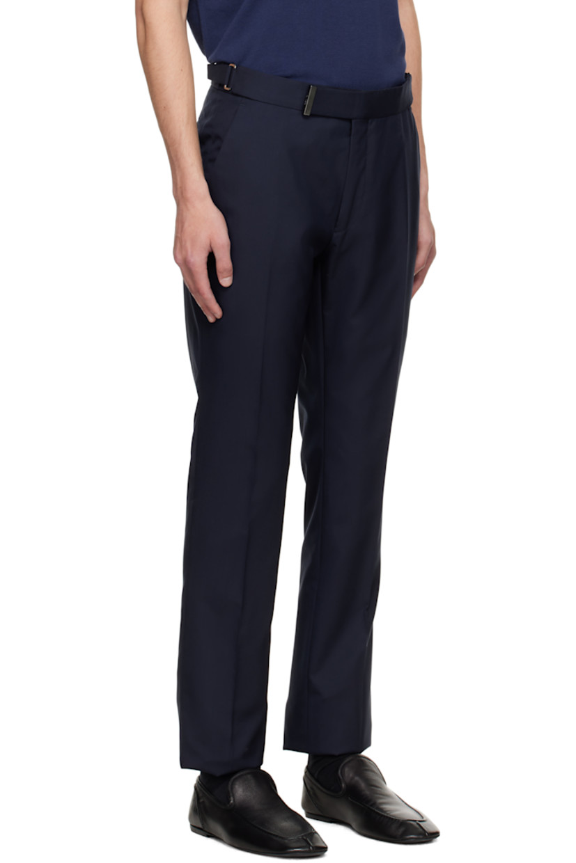Plain-woven wool trousers.

· Cinch tabs at waistband
· Four-pocket styling
· Zip fly
· Creased legs
· Unfinished hem
· Buttons and notch at back waistband
· Partial satin lining

Supplier color: Midnight blue
