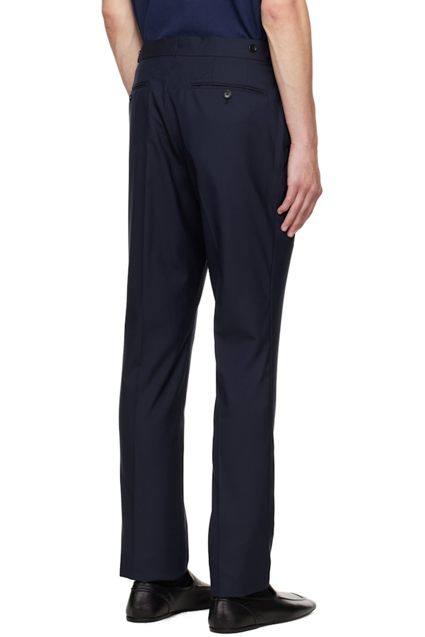 Plain-woven wool trousers.

· Cinch tabs at waistband
· Four-pocket styling
· Zip fly
· Creased legs
· Unfinished hem
· Buttons and notch at back waistband
· Partial satin lining

Supplier color: Midnight blue