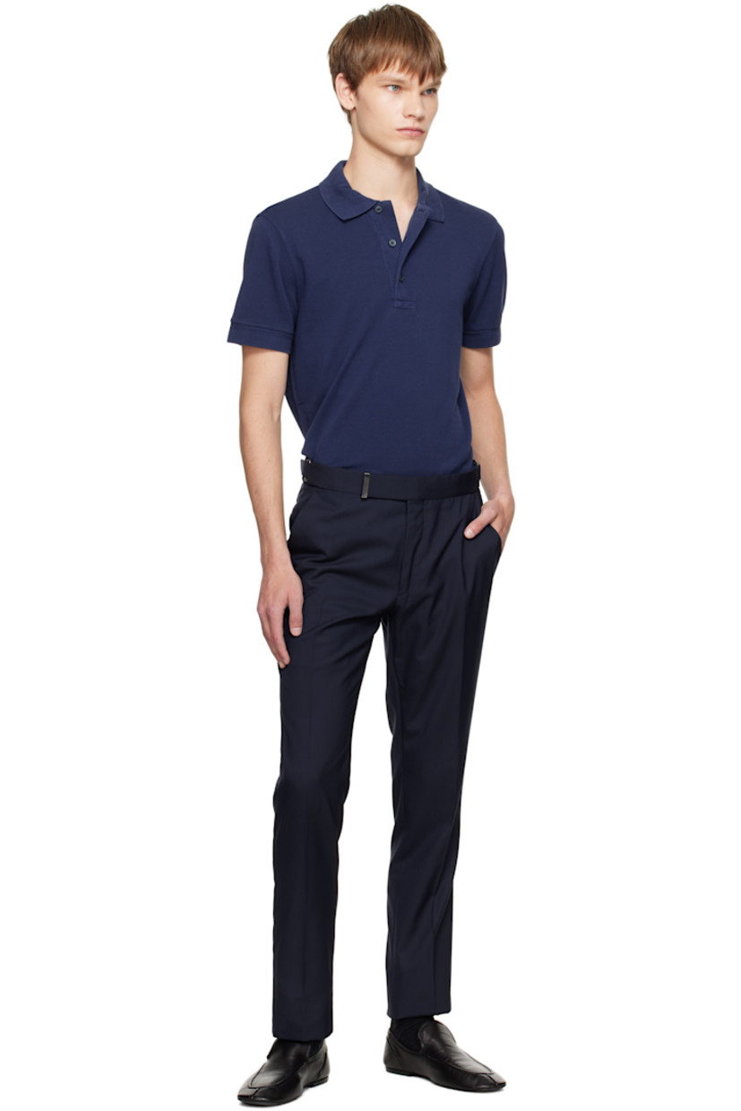 Plain-woven wool trousers.

· Cinch tabs at waistband
· Four-pocket styling
· Zip fly
· Creased legs
· Unfinished hem
· Buttons and notch at back waistband
· Partial satin lining

Supplier color: Midnight blue