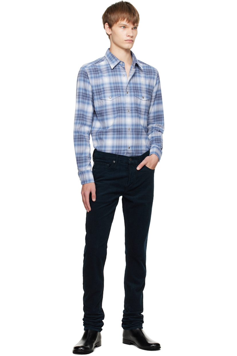 Cotton flannel shirt.

· Check pattern throughout
· Spread collar
· Press-stud closure
· Western yoke at front and back
· Flap pockets at chest
· Shirttail hem
· Press-stud barrel cuffs

Supplier color: Combo blue