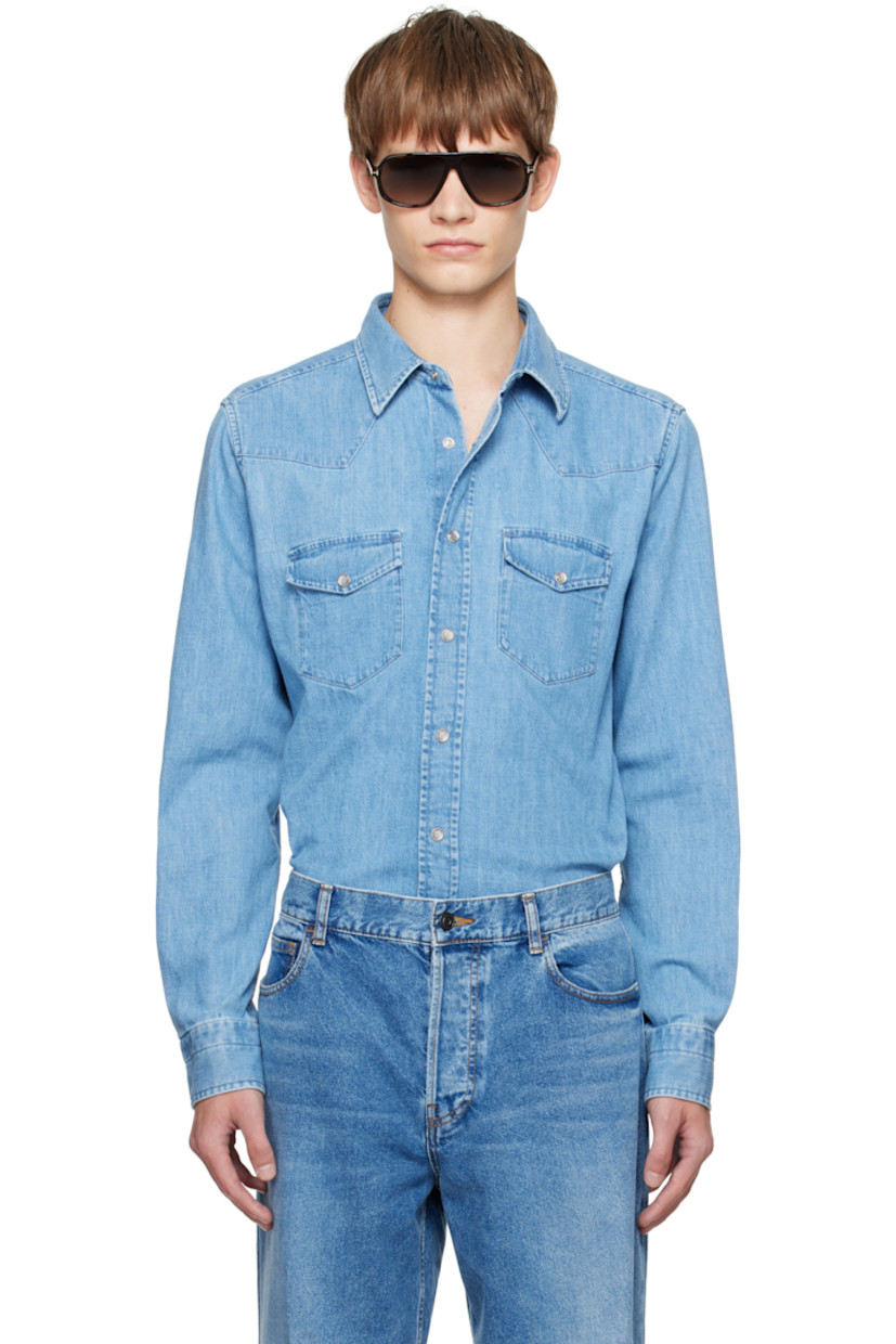 Non-stretch denim shirt.

· Fading throughout
· Spread collar
· Press-stud closure
· Western yoke at front and back
· Flap pockets at chest
· Shirttail hem
· Press-stud barrel cuffs

Supplier color: Washed blue