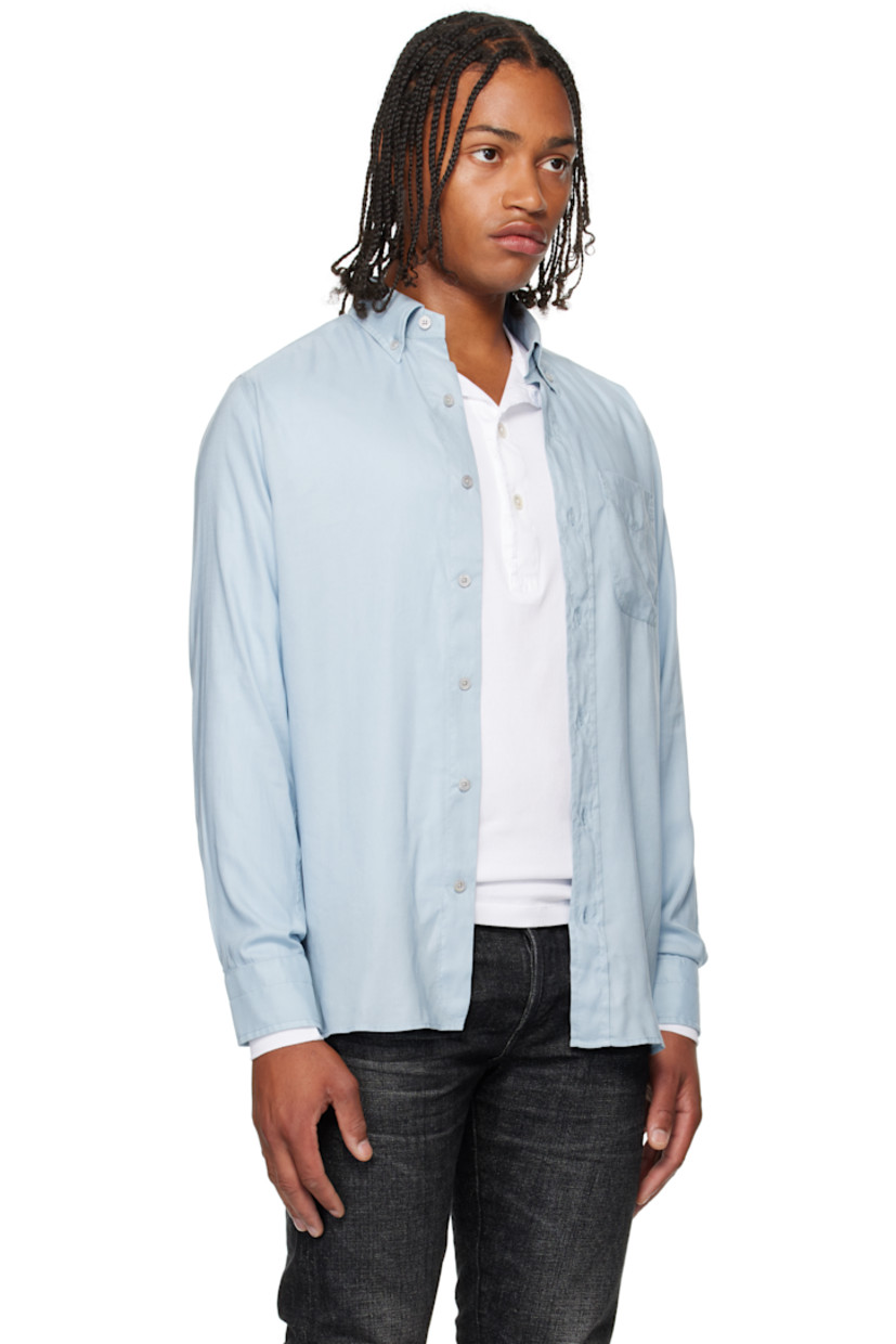 Lyocell gabardine shirt. 

· Button-down spread collar 
· Button closure
· Flap pocket at chest 
· Shirttail hem
· Pleats at buttoned barrel cuffs

Supplier color: Sky blue
