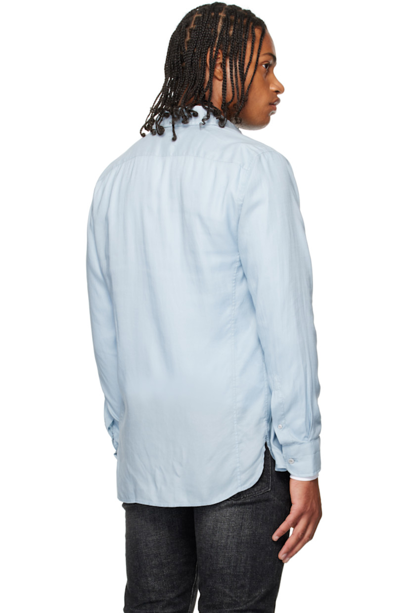 Lyocell gabardine shirt. 

· Button-down spread collar 
· Button closure
· Flap pocket at chest 
· Shirttail hem
· Pleats at buttoned barrel cuffs

Supplier color: Sky blue