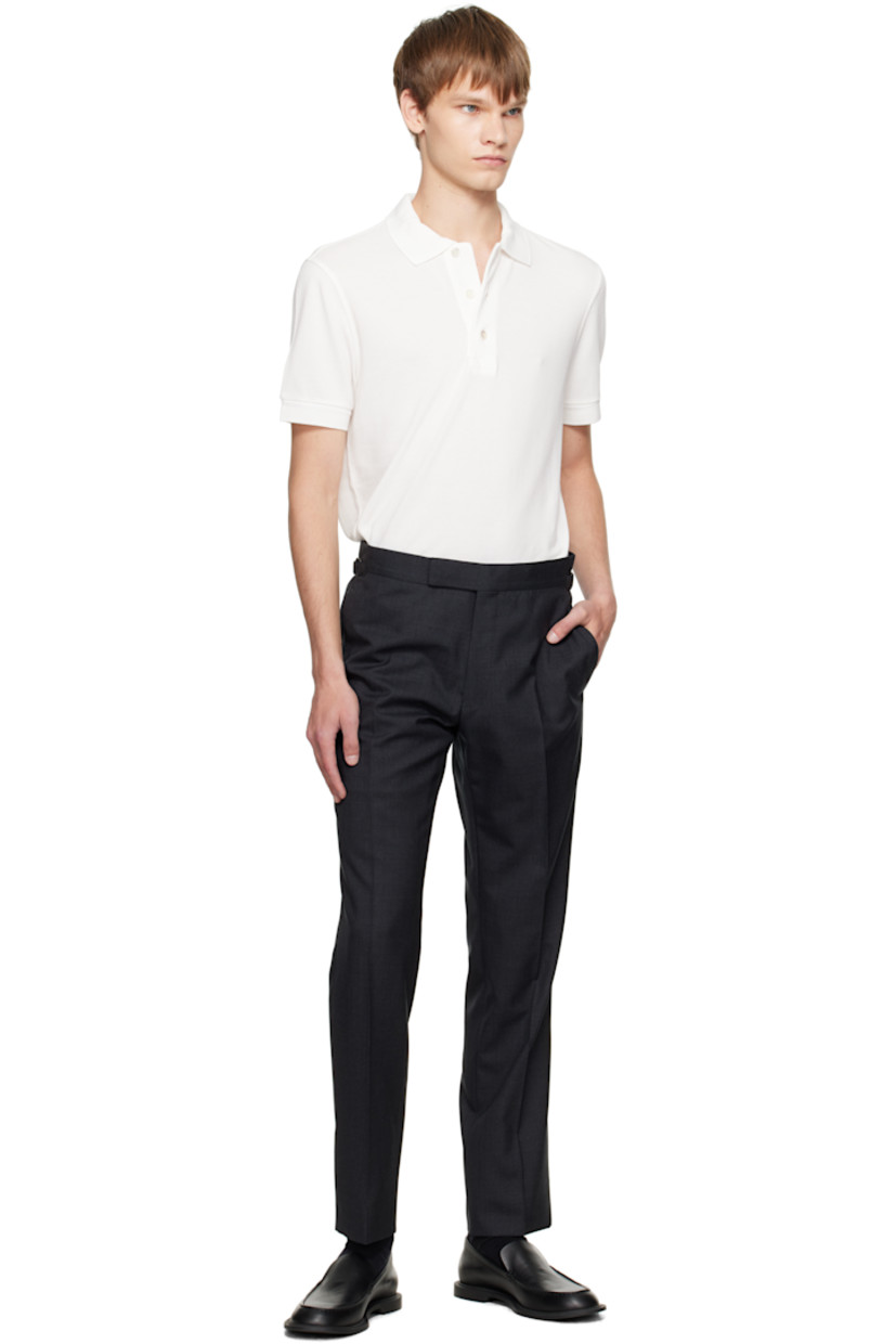 Lyocell- and cotton-blend piqué polo.

· Rib-knit spread collar and cuffs
· Three-button placket
· Logo embroidered at front hem 
· Tennis-tail hem

Supplier color: White