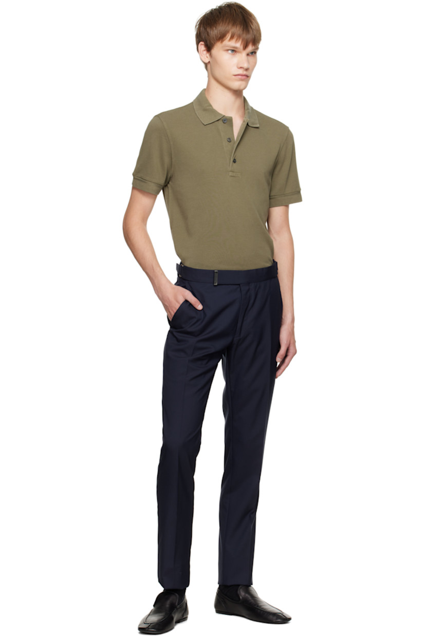 Lyocell- and cotton-blend piqué polo.

· Rib-knit spread collar and cuffs
· Three-button placket
· Logo embroidered at front hem 
· Tennis-tail hem

Supplier color: Pale army
