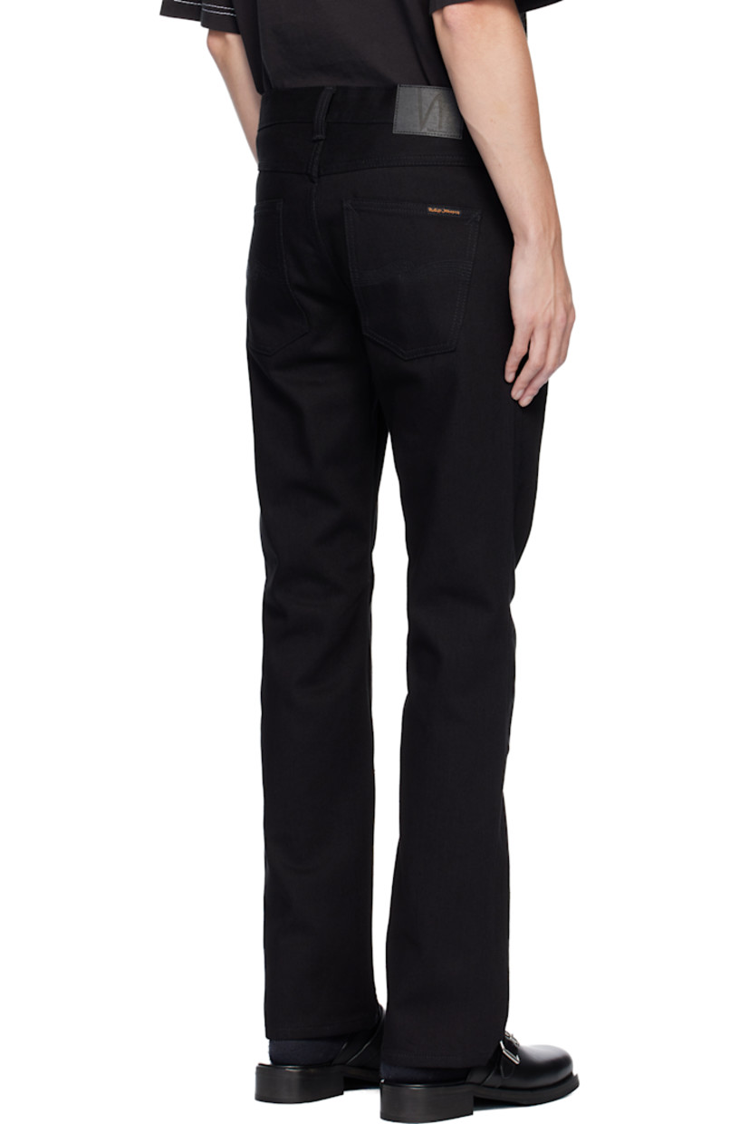 12.3 oz non-stretch organic cotton denim jeans. 

· Slim-fit
· Mid-rise
· Belt loops
· Five-pocket styling
· Button fly 
· Logo patch at back waistband 
· Logo flag at back pocket

Supplier color: Dry black tar