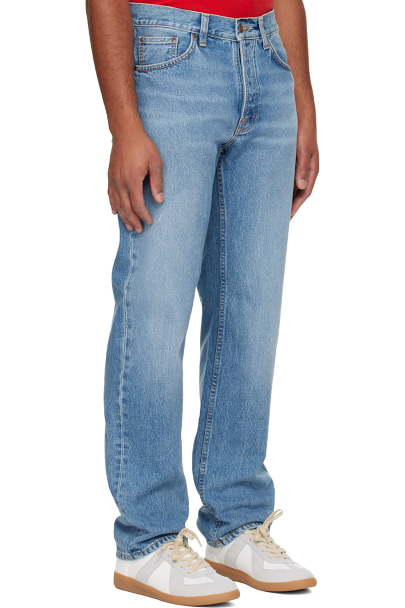 14.9 oz non-stretch organic cotton denim jeans.

· Fading and whiskering throughout
· Straight-leg
· High-rise
· Belt loops
· Five-pocket styling
· Button fly
· Logo patch at back waistband and pocket
· Contrast stitching in tan

Supplier color: Indigo blues