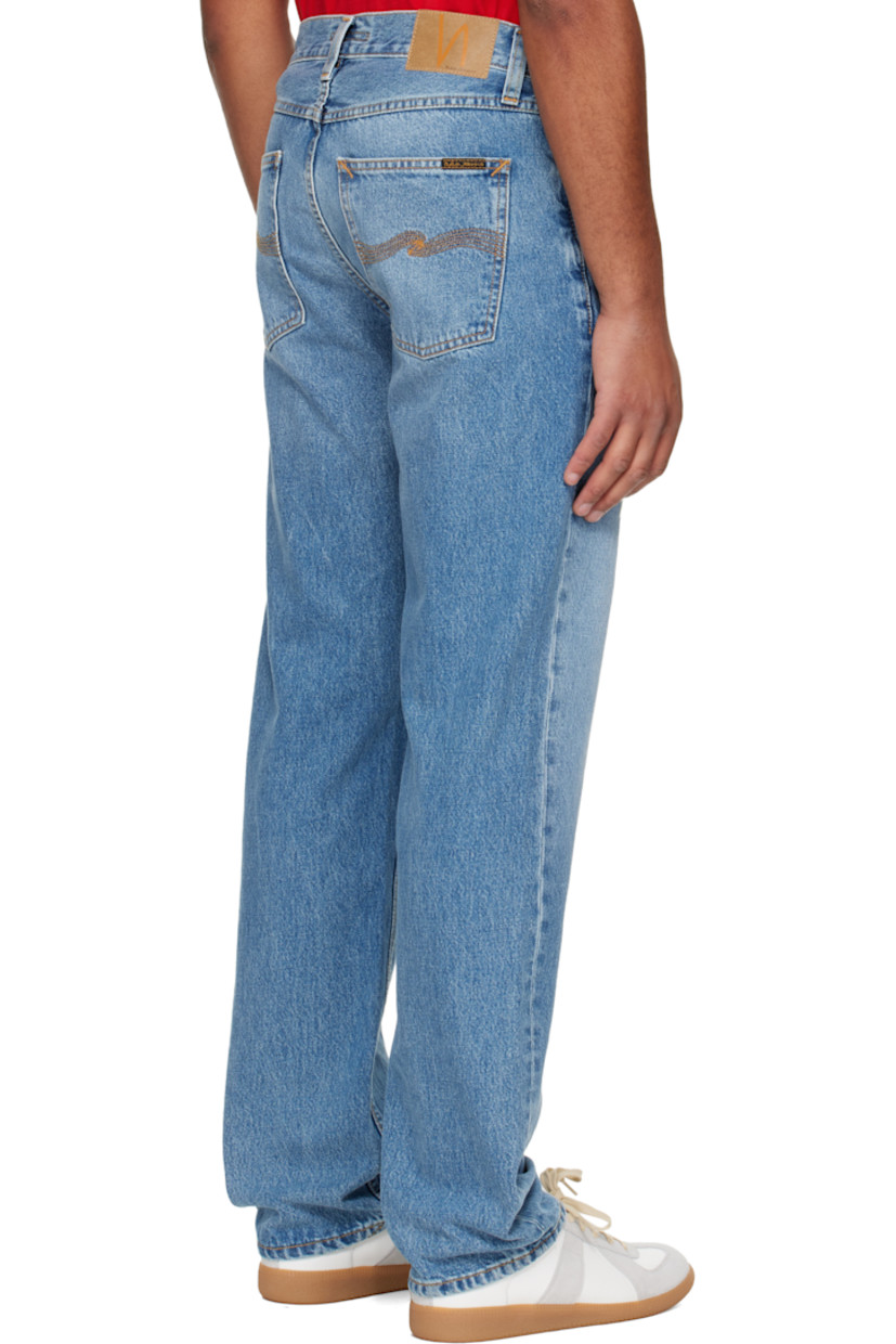 14.9 oz non-stretch organic cotton denim jeans.

· Fading and whiskering throughout
· Straight-leg
· High-rise
· Belt loops
· Five-pocket styling
· Button fly
· Logo patch at back waistband and pocket
· Contrast stitching in tan

Supplier color: Indigo blues