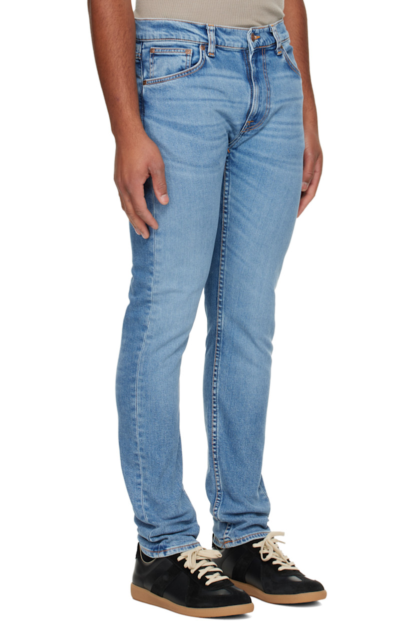12.5 oz stretch organic cotton denim jeans.

· Fading and whiskering throughout
· Tapered, slim-fit
· Mid-rise
· Belt loops
· Five-pocket styling
· Zip fly
· Logo patch at back waistband and pocket
· Contrast stitching in tan

Supplier color: Lost orange