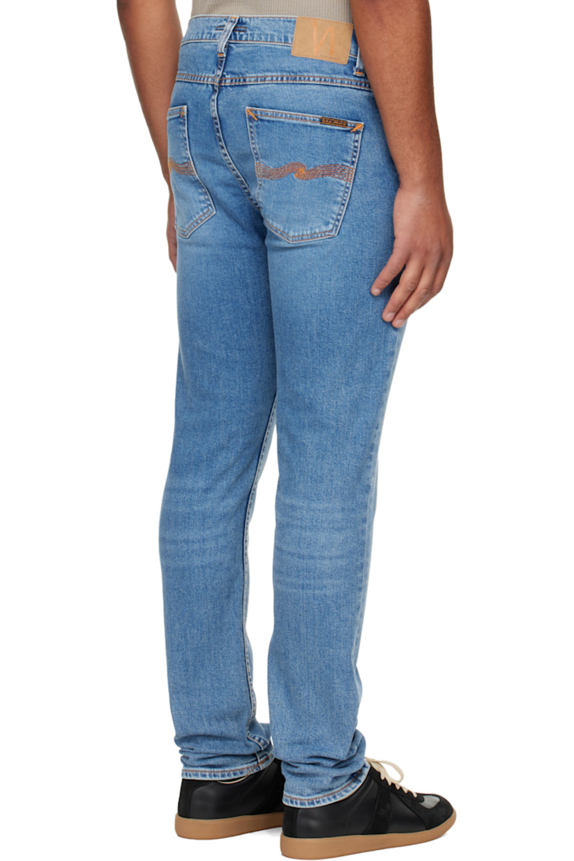 12.5 oz stretch organic cotton denim jeans.

· Fading and whiskering throughout
· Tapered, slim-fit
· Mid-rise
· Belt loops
· Five-pocket styling
· Zip fly
· Logo patch at back waistband and pocket
· Contrast stitching in tan

Supplier color: Lost orange