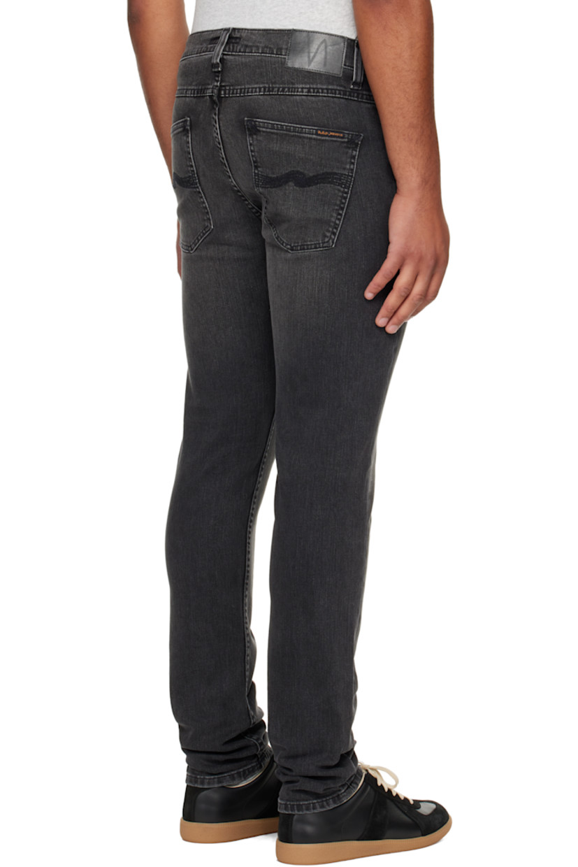 11.75 oz stretch organic cotton denim jeans.

· Fading and whiskering throughout
· Tapered, slim-fit
· Mid-rise
· Belt loops
· Five-pocket styling
· Zip fly
· Logo patch at back waistband and pocket

Supplier color: Black eyes