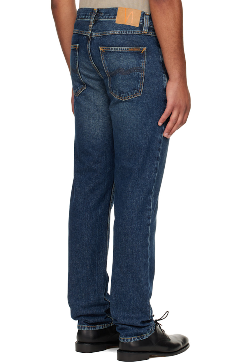 14.9 oz non-stretch organic cotton denim jeans.

· Fading throughout
· Straight-leg
· Mid-rise
· Belt loops
· Five-pocket styling
· Zip fly
· Logo patch at back waistband and pocket
· Contrast stitching in tan

Supplier color: Blue soil
