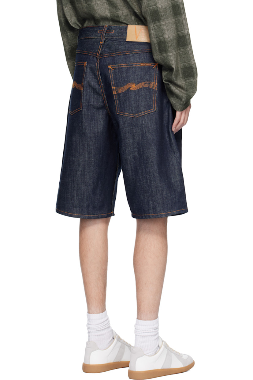 13.7 oz non-stretch organic cotton denim shorts.

· Loose-fit, wide-leg
· High-rise 
· Belt loops
· Five-pocket styling
· Button fly 
· Logo patch at back waistband 
· Logo flag at back pocket
· Contrast stitching in tan

Supplier color: Dry streaky